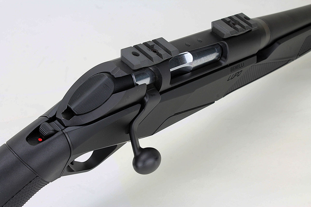 Visible here are the Lupo’s Picatinny rail mounts, nearly flat, serrated-bolt cap and tang safety. Note how far the bolt handle protrudes from the stock to clear scope ocular lenses.